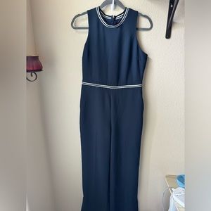 Navy blue jumpsuit with kick pleats on legs. Has pockets. Worn once.